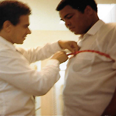 Muhammad Ali getting measured